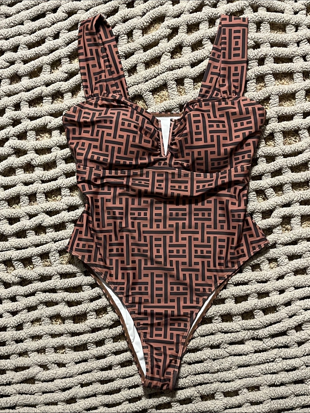 Pretty one piece swimsuit. Brown and black with sexy V cleavage and high hip cut